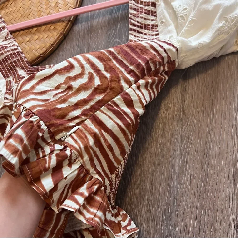 Anthropologie love the‎ label zebra laser cut puff sleeve smocked blouse